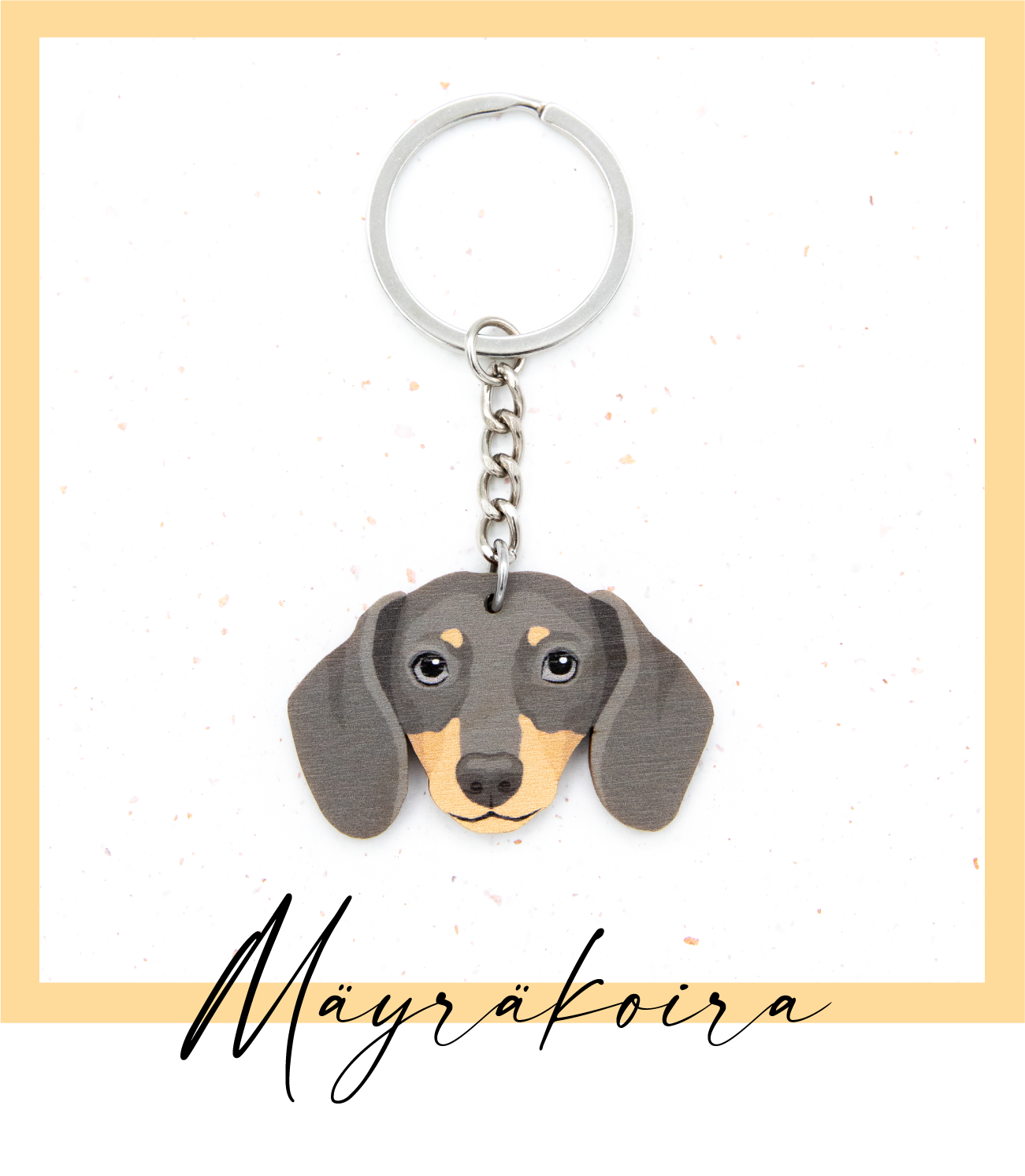 Suomalaisesta koivuvanerista ja teräksestä valmistettu musta lyhytkarvainen mäyräkoira avaimenperä